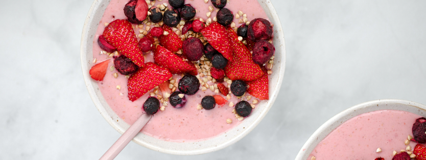 smoothie bowl topped with berries and granola