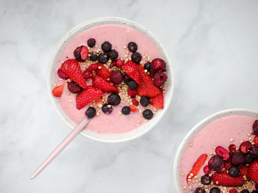 smoothie bowl topped with berries and granola