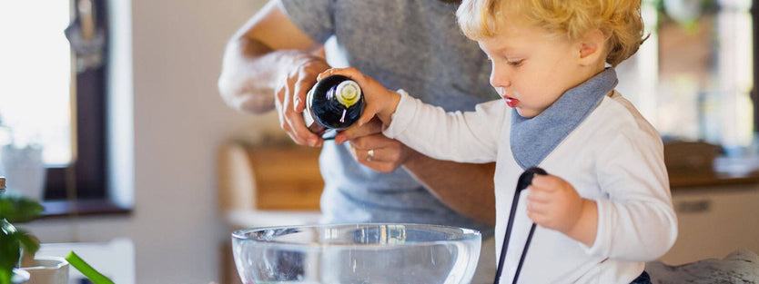 Toddler helping in the kitchen