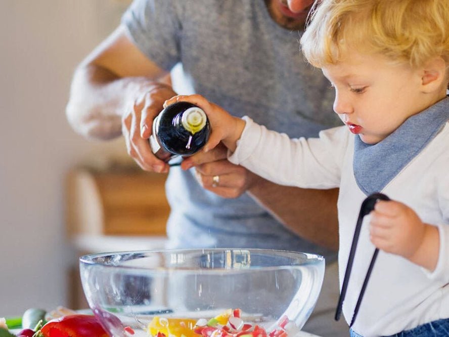 Toddler helping in the kitchen
