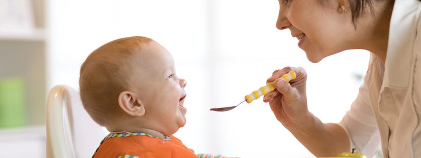 Baby being spoon fed