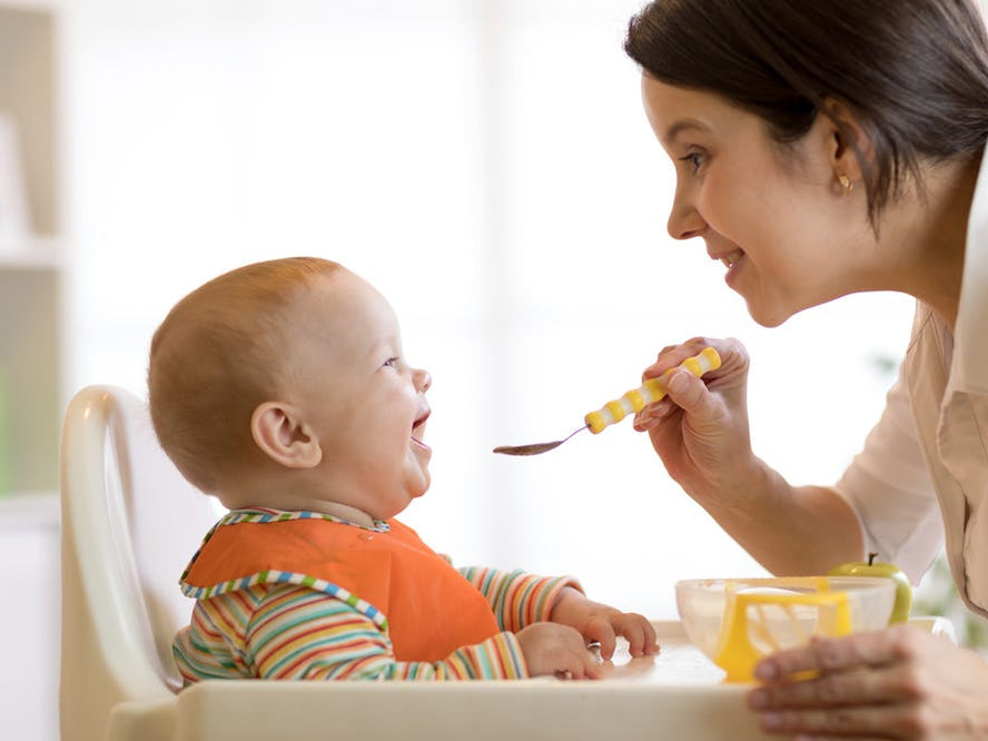 Baby being spoon fed